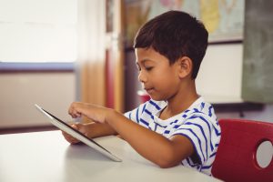 child using a tablet at school